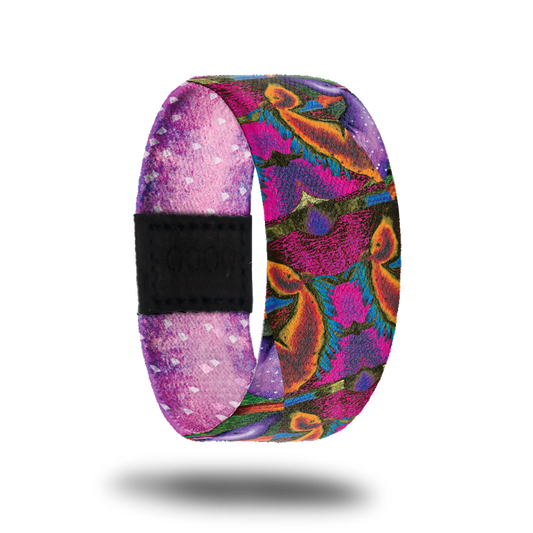 Outside is brightly colored abstract designs. Colors are hot pink, purple, orange, green and blue.