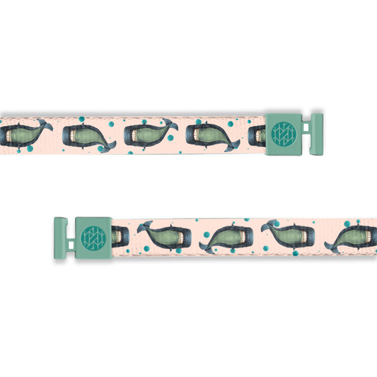 Hoodie string that is pale pink and has blue and green whales all over mixed with blue bubbles.