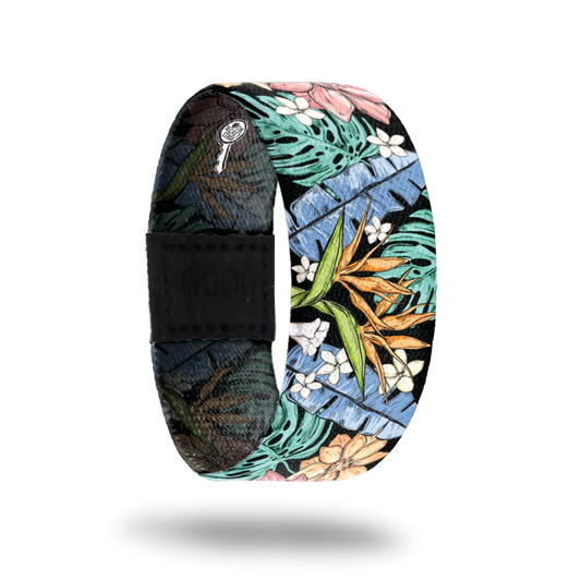 Outside is black with big leaves and flowers all over. Leaves are in colors of green, orange, light pink and has orange and white flowers.
