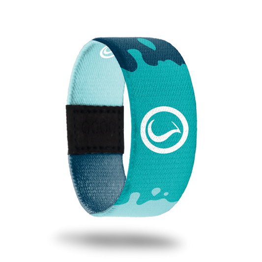 Outside is navy, teal and light blue resembling water. In the center is a white symbol.