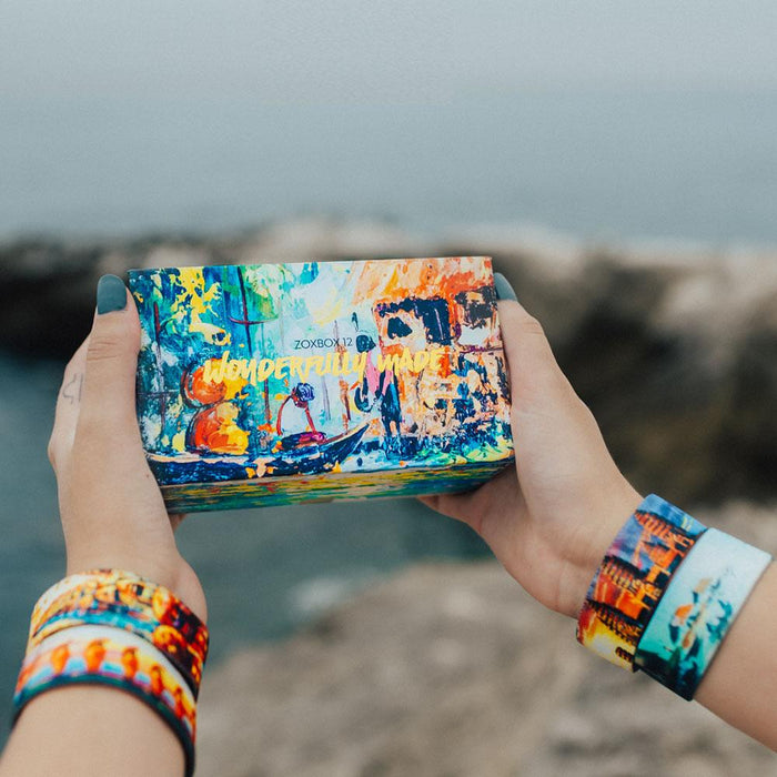 Lifestyle photo of someone holding the box while wearing bands