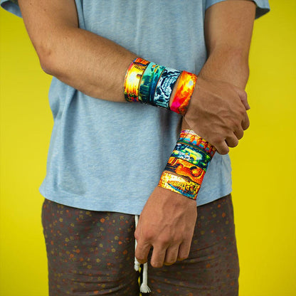 Lifestyle photo of someone with their arms crossed while wearing all 8 bands